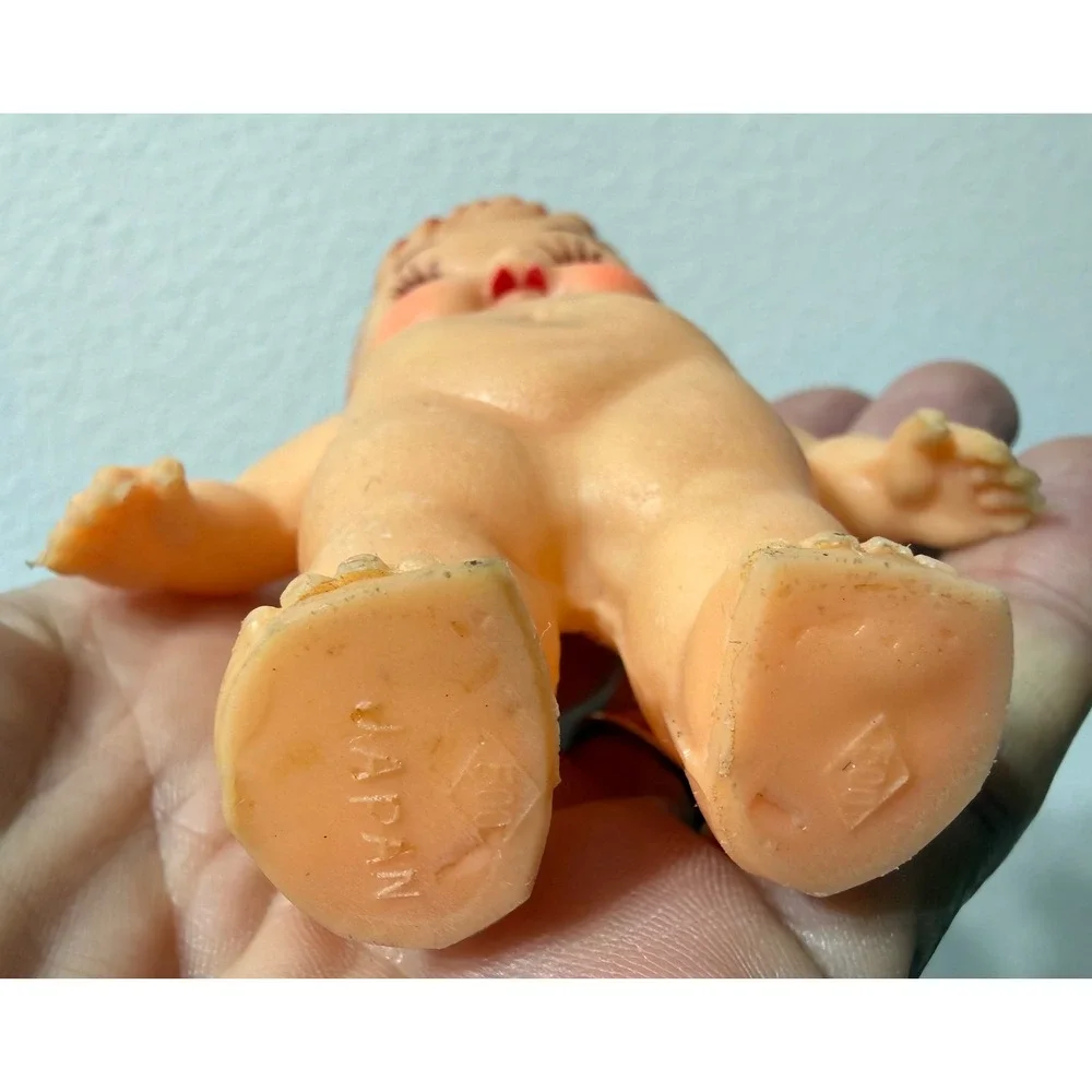 Vintage Japan Rubber Baby Doll Squeeze Toy Top Knot Bun Blue Eyes Kitsch 4.75in